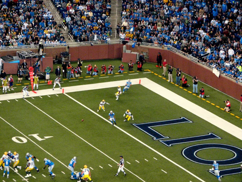 Elevated view of a Lions receiver making a catch at the goal line in front of the Ford Field end zone and a full crowd