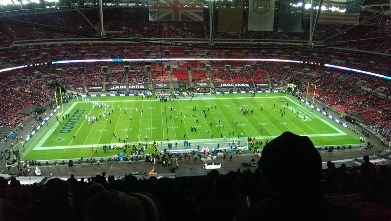 Wembley Stadium before kickoff of Cowboys–Jaguars, seen from the upper tier with the Cowboys end zone in view